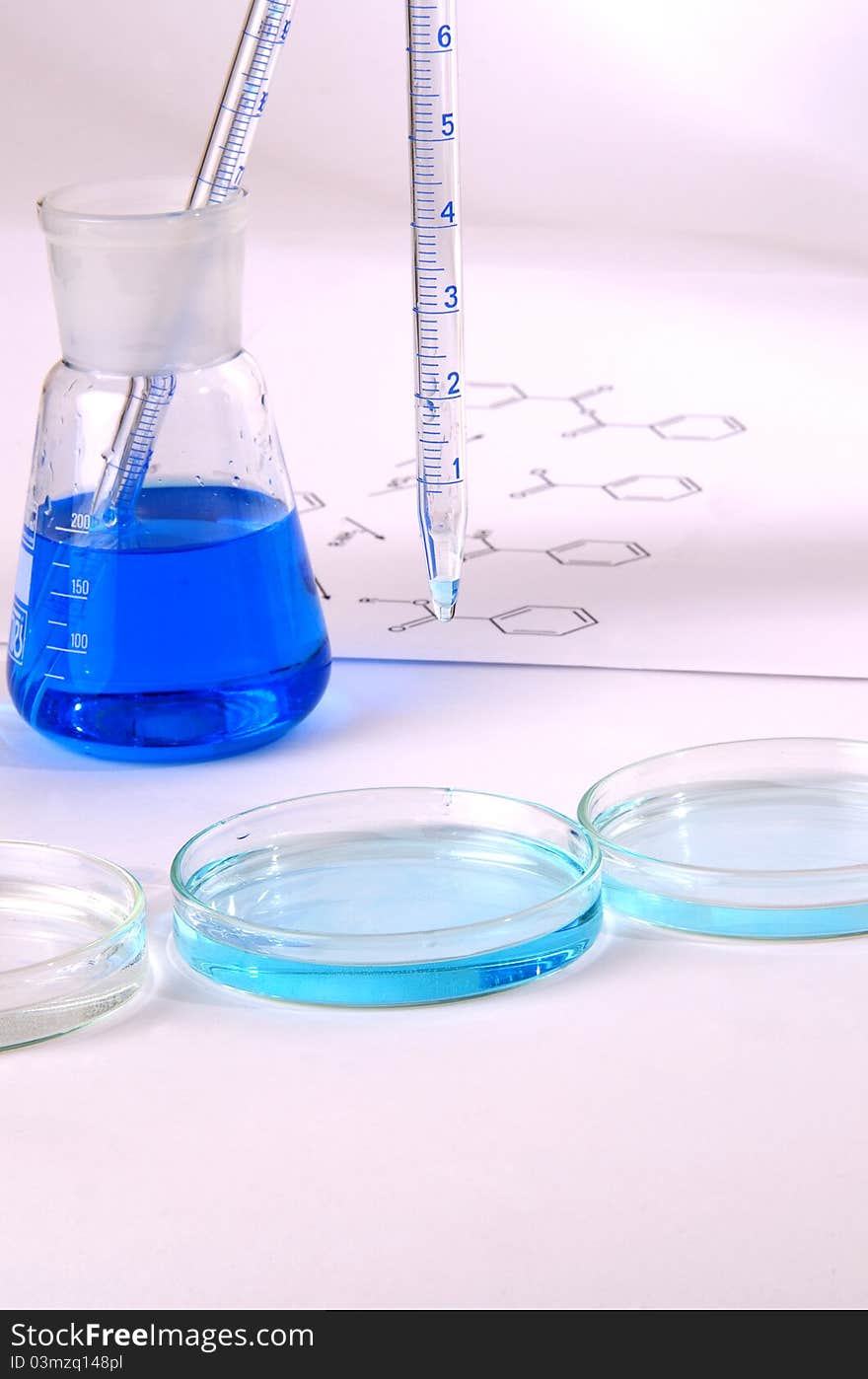 Laboratory glassware with blue chemical