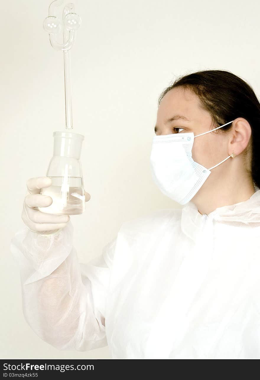 Female Scientist is working in a chemical lab. Female Scientist is working in a chemical lab