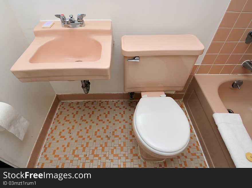 Top down shot of washing basin and toilet bowl beside. Top down shot of washing basin and toilet bowl beside.