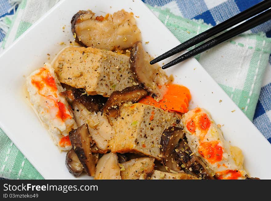 Oriental style prawn and tofu dish on white plate. Oriental style prawn and tofu dish on white plate.