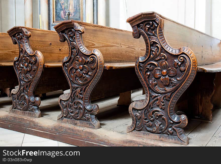 Detailed view of an old wooden church pews.