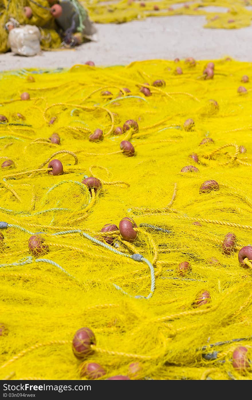 Yellow fishing nets stretched in the sun