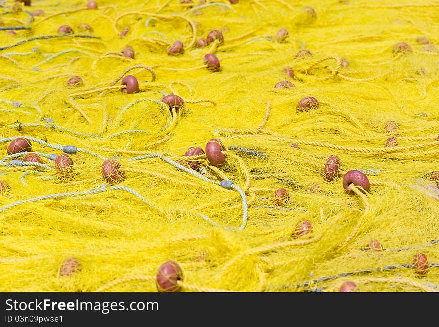 Yellow fishing nets stretched in the sun