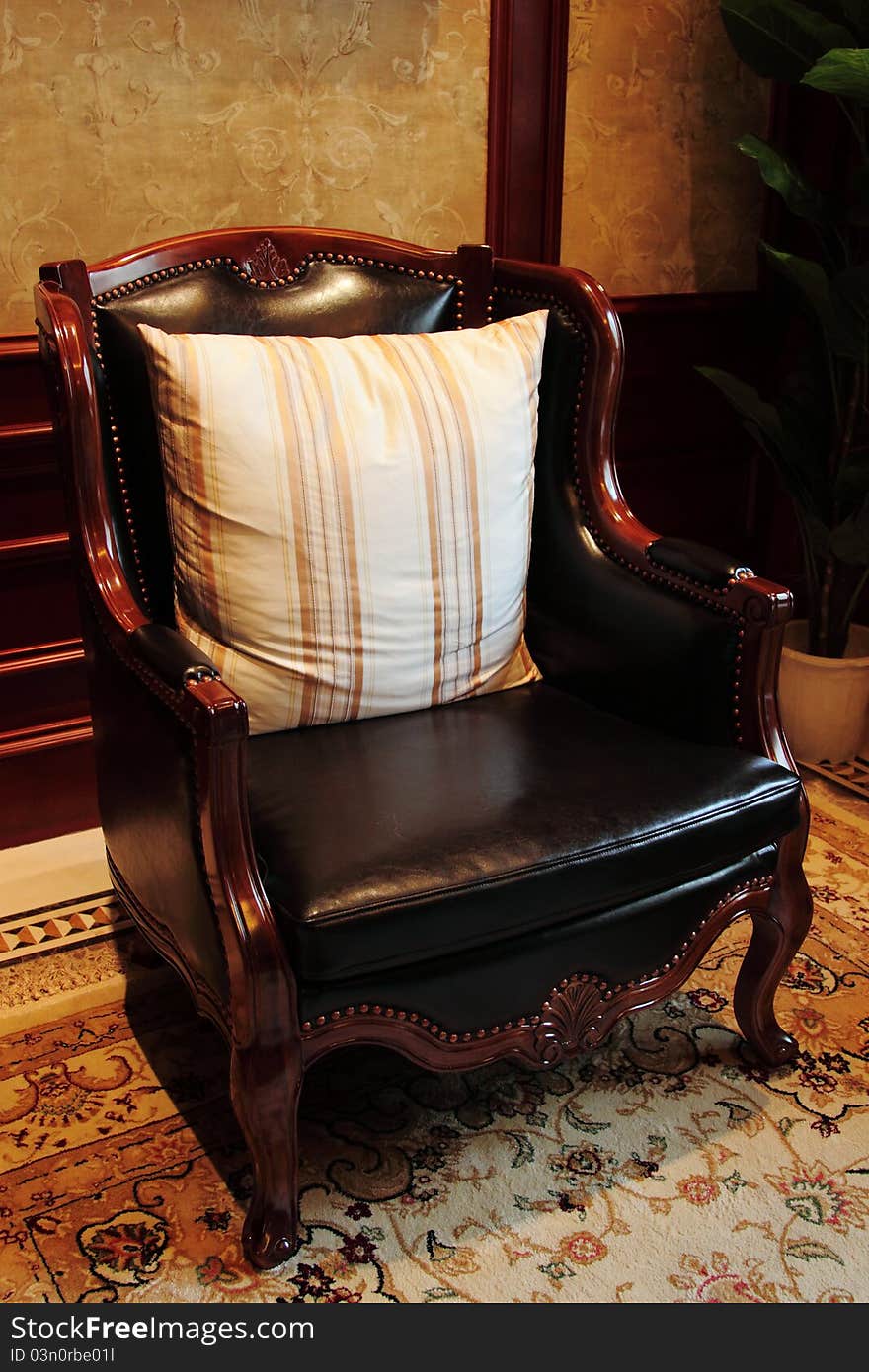 Beautiful and decorative chair sitting on carpet and/or tile floor. Beautiful and decorative chair sitting on carpet and/or tile floor