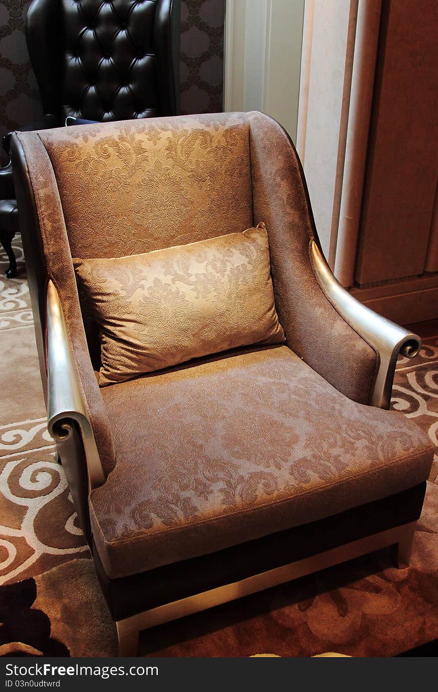 Beautiful and decorative chair sitting on carpet and/or tile floor. Beautiful and decorative chair sitting on carpet and/or tile floor