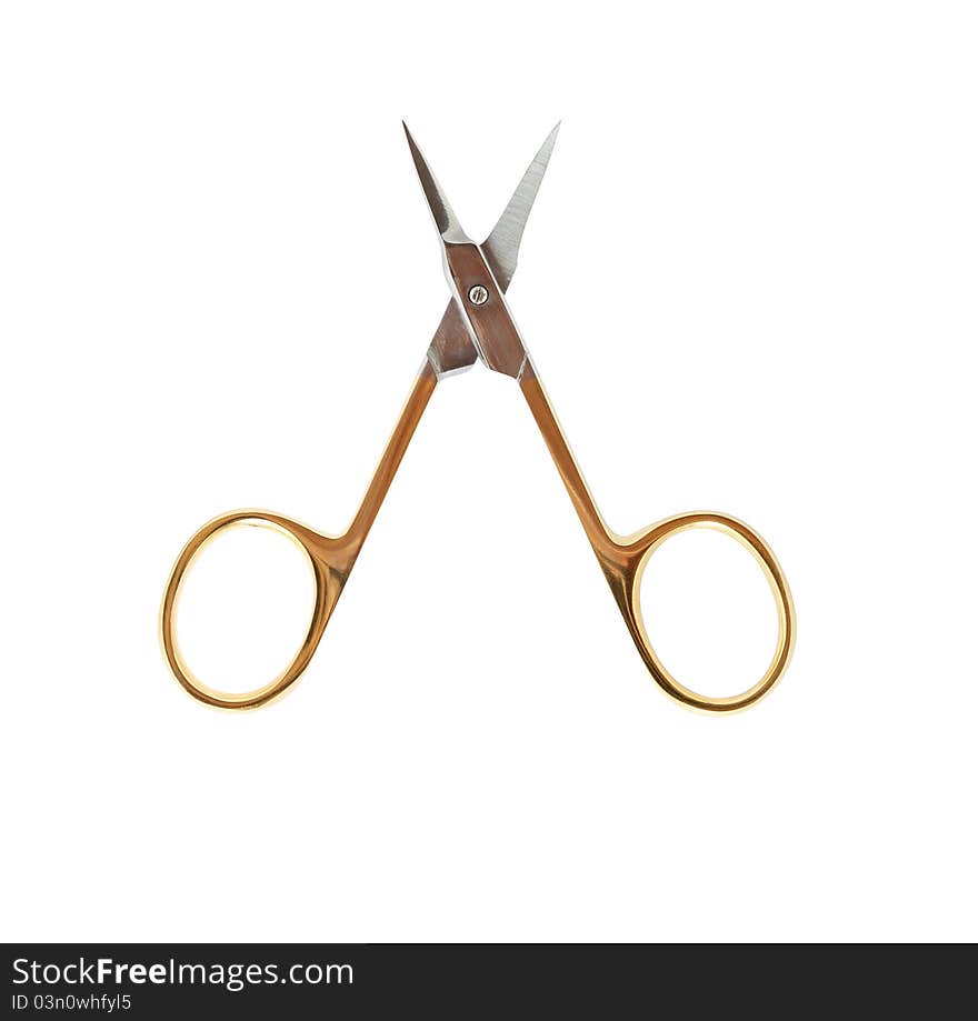 Golden manicure scissors isolated on white background with clipping path. Golden manicure scissors isolated on white background with clipping path