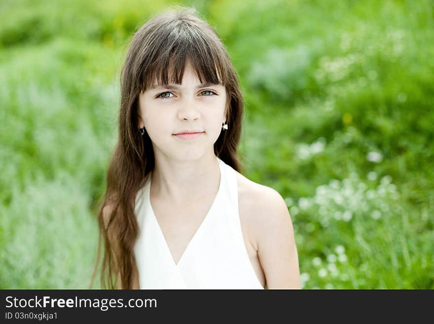 Little girl is seating in grass. Little girl is seating in grass