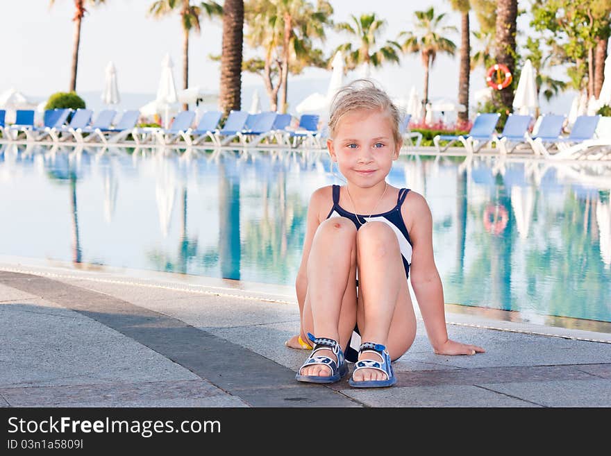 Beautiful girl posing at the swimming pool. Beautiful girl posing at the swimming pool