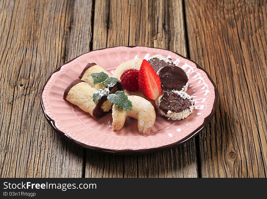 Variety of cookies on a pink plate