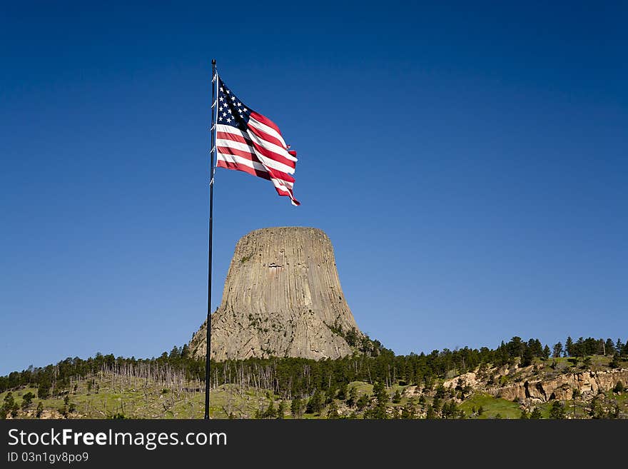 An American flag waves near the entrance to Devils Tower park in Wyoming. An American flag waves near the entrance to Devils Tower park in Wyoming.