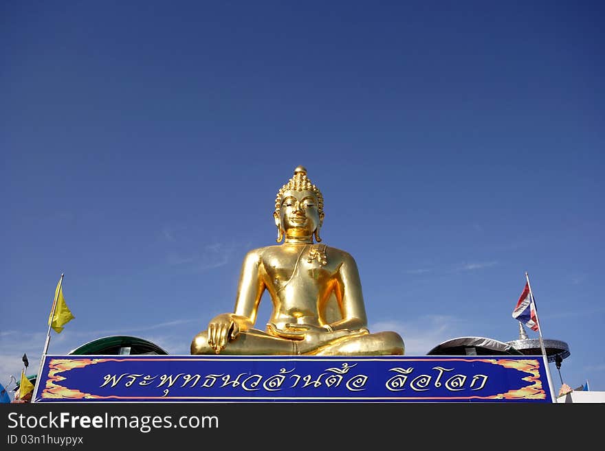 Big golden buddha with blue sky, Chiangrai province, Thailand.