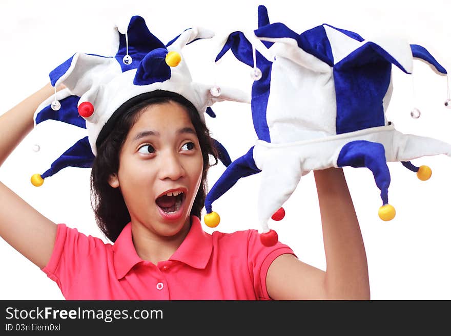 Young lady having fun with clown hats