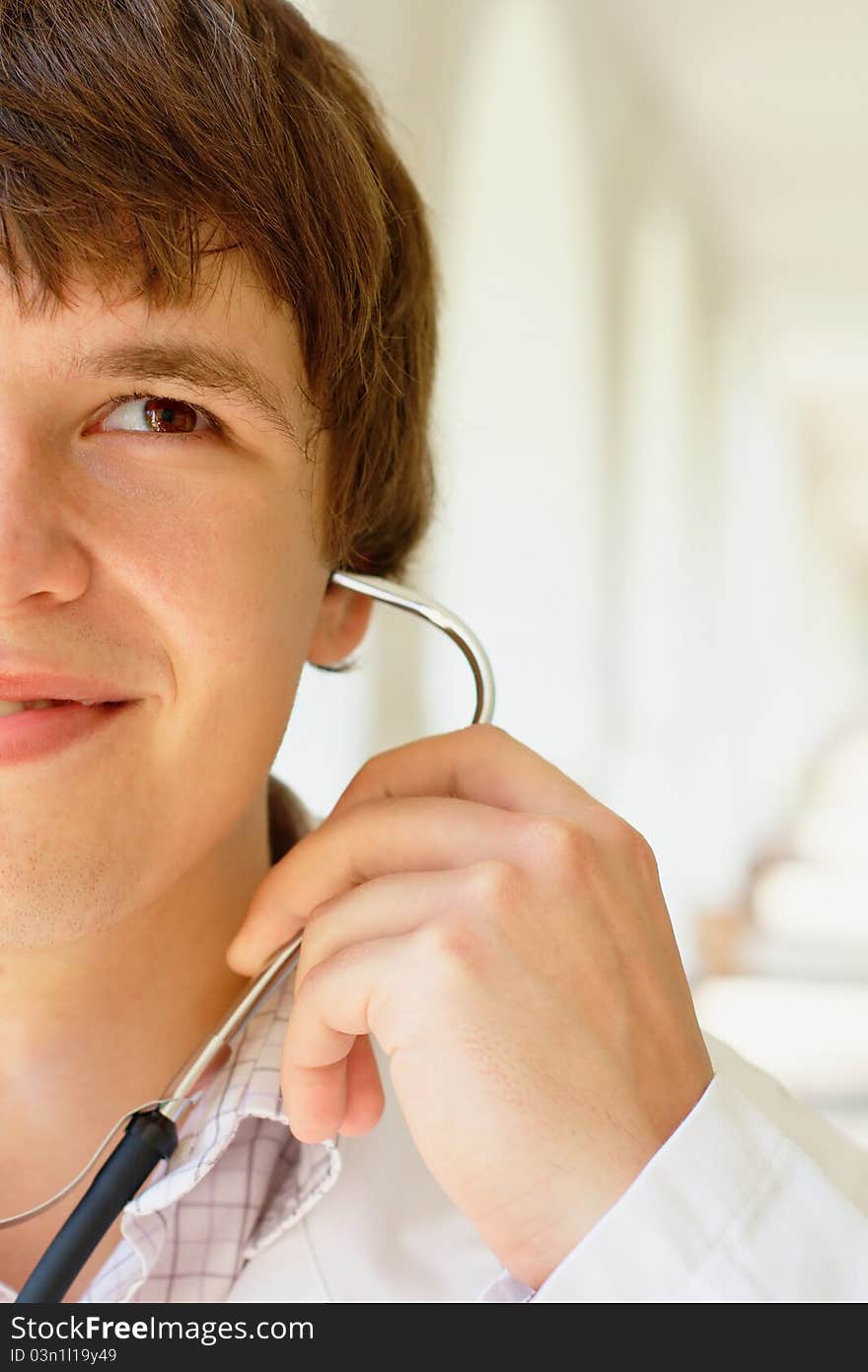 Photo of the doctor holding a stethoscope with copy space