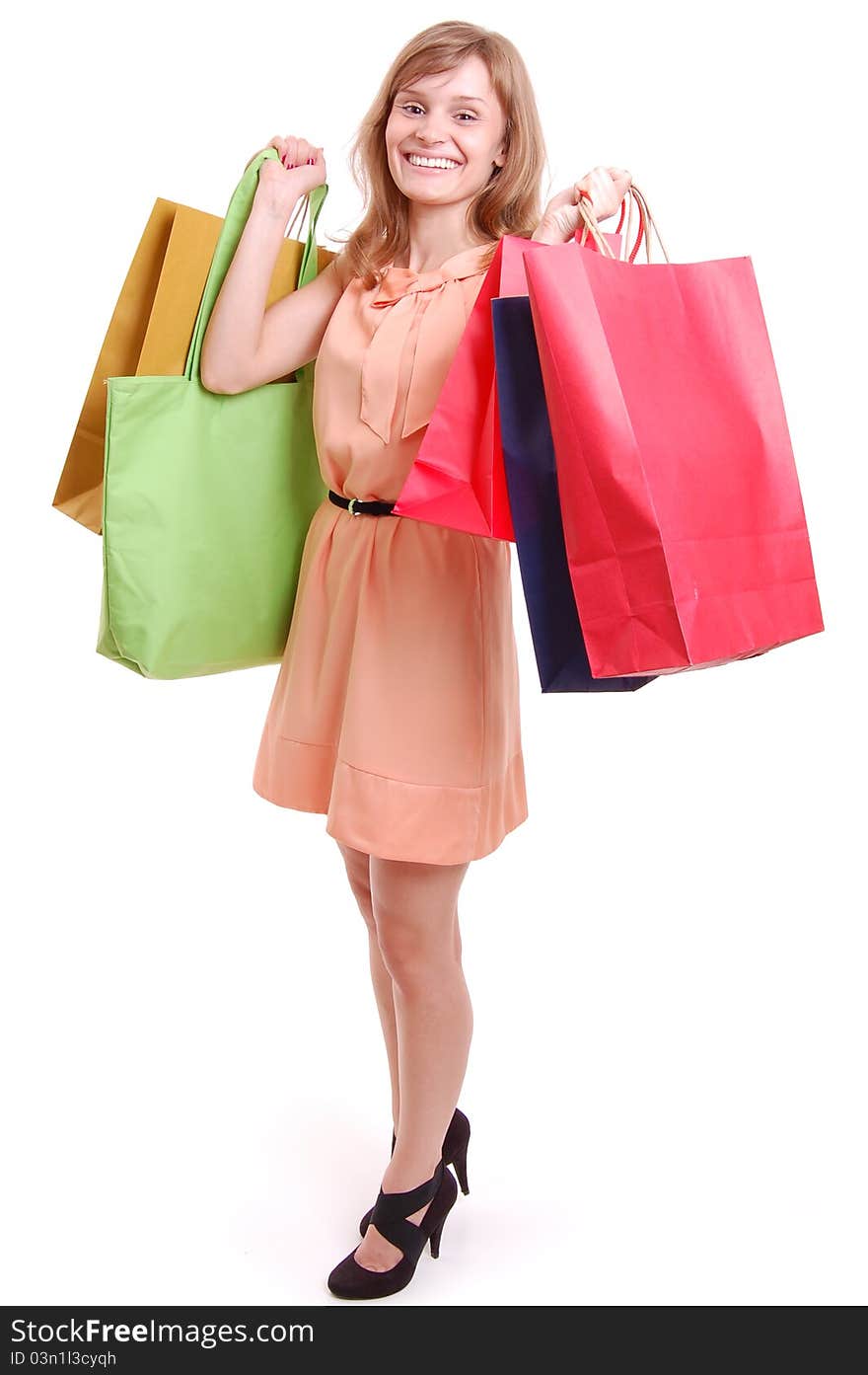 Young girl with shopping bags isolated on white