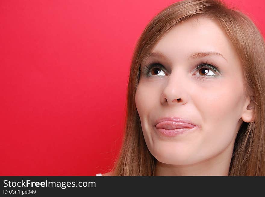 Portrait of a young woman on red