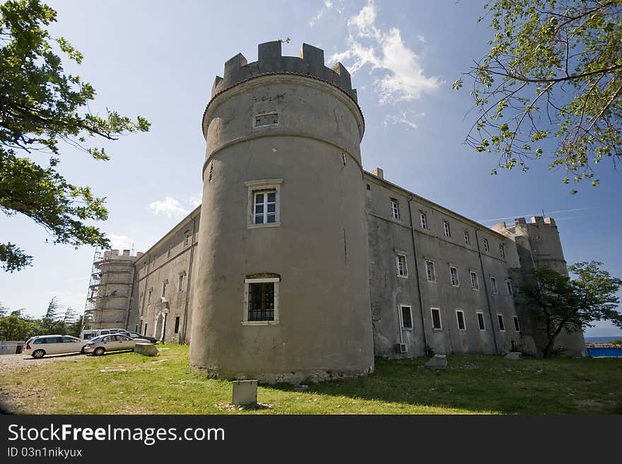 Exterior of the medival castle Zrinski-Frankopan with the tower and the blue sky. Exterior of the medival castle Zrinski-Frankopan with the tower and the blue sky