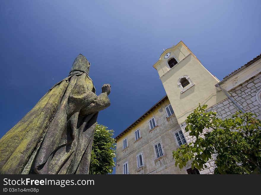 Statue And Church Of St.Nicholas In Kraljevica