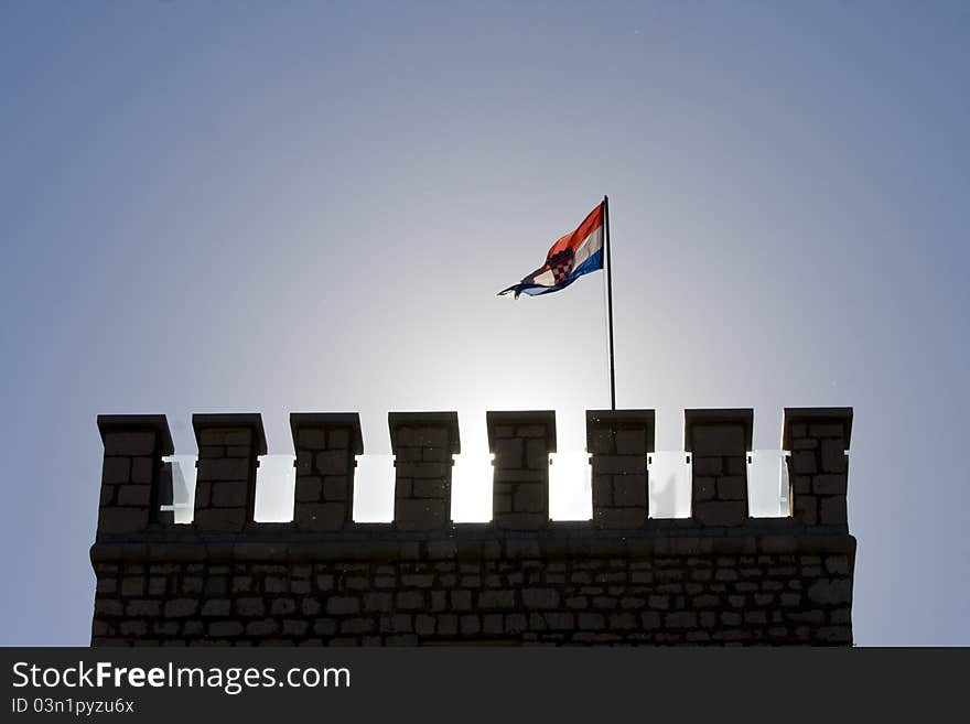 Tower of Frankopan castle in Novi Vindolski with the Croatian flag