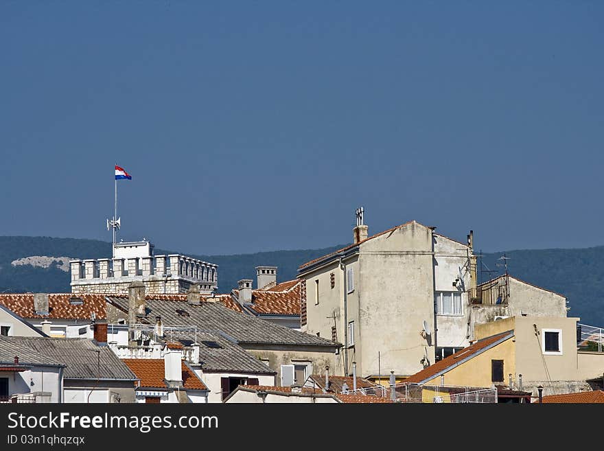 Panoramic view on the urban part of Novi Vinodolski with it`s roofs and buildings. Panoramic view on the urban part of Novi Vinodolski with it`s roofs and buildings