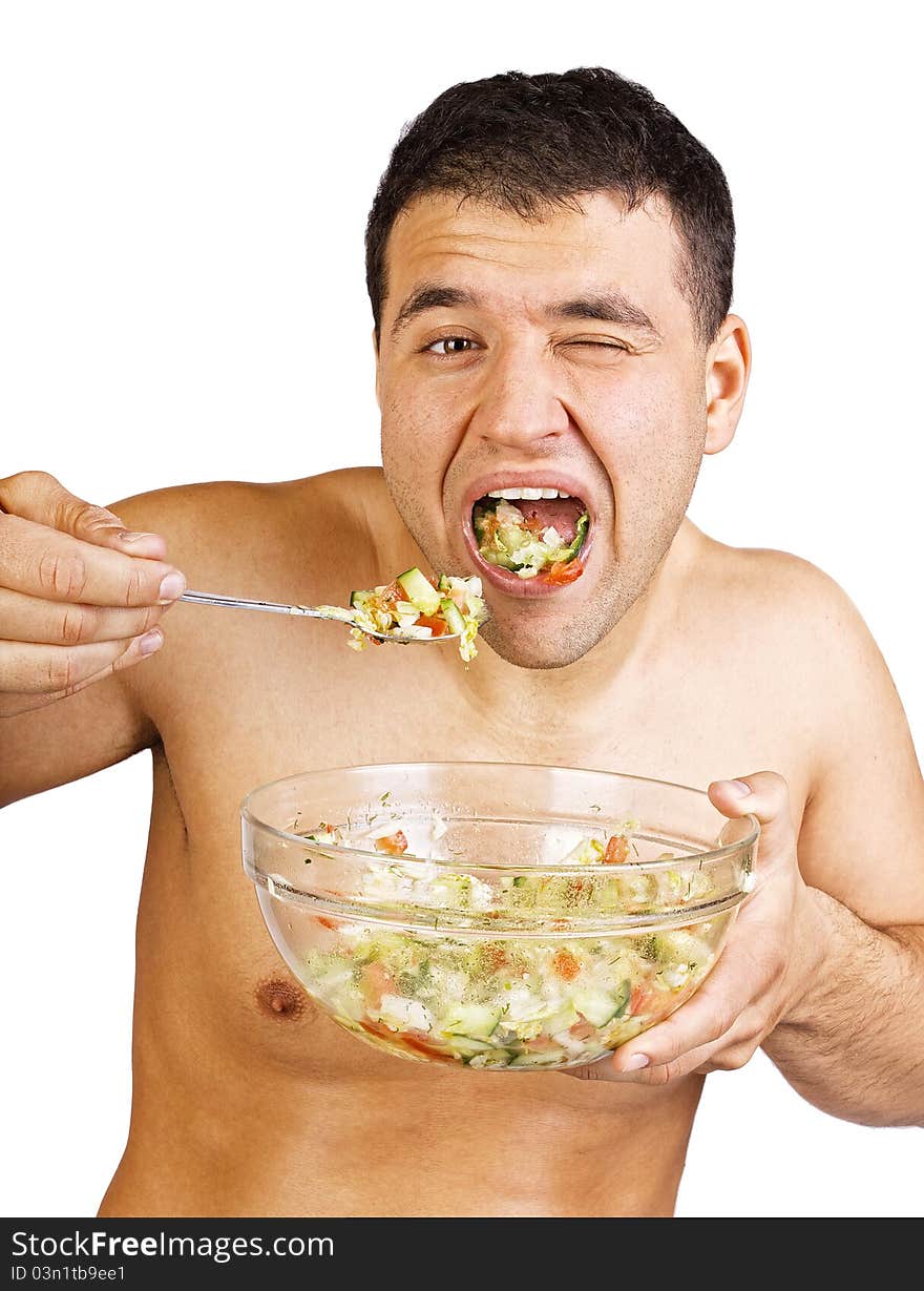 Man is eating a salad. Man is eating a salad