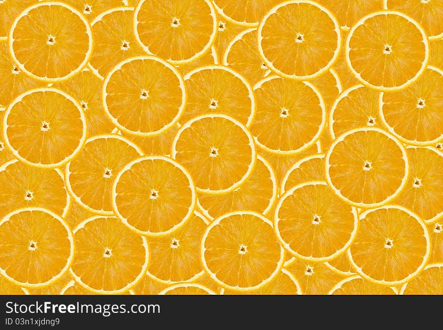 Orange background from slices of oranges