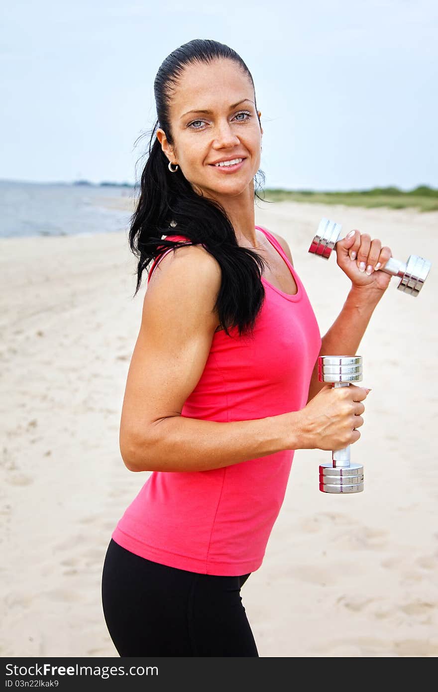 Sexy sportswoman is doing exercise. Sexy sportswoman is doing exercise