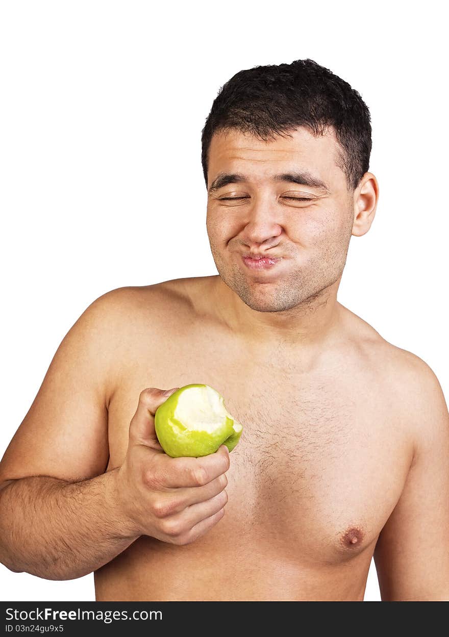 Happy man eating green apple. Happy man eating green apple