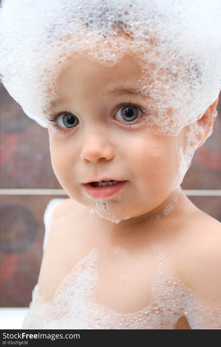 Little boy with foam on his head. Little boy with foam on his head