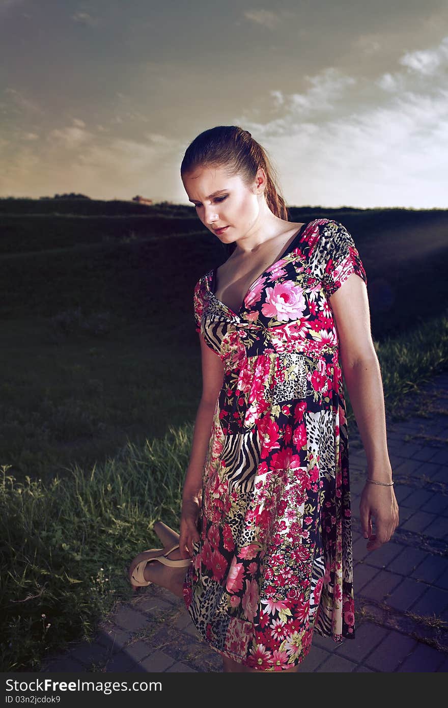 Portrait of woman in variegated sundress