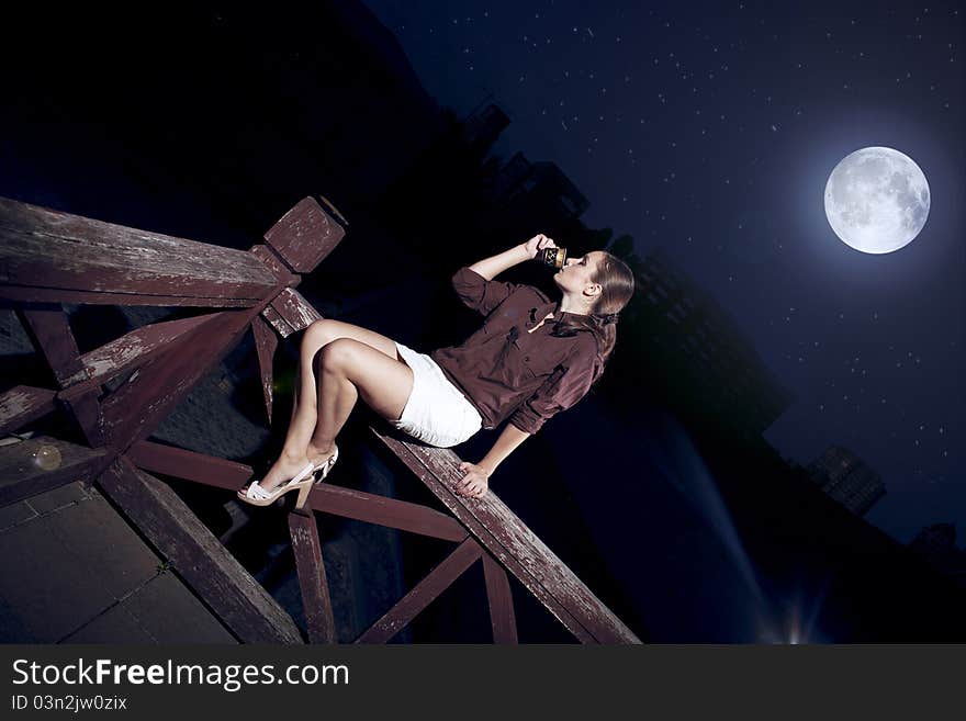 Brunette beauty posing at full moon. Brunette beauty posing at full moon