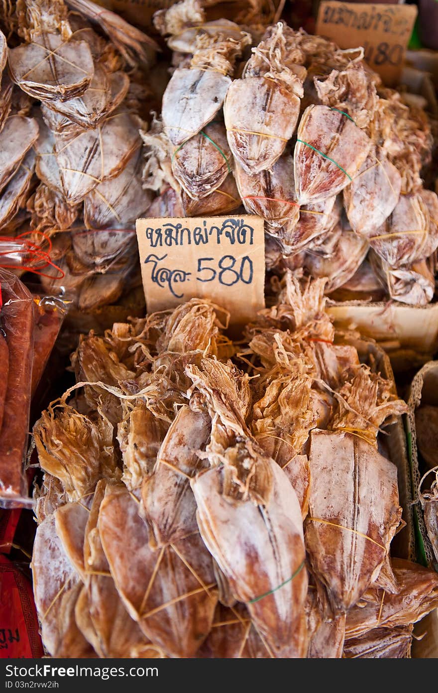 Drief squid for sale at a market in south-east Asia. Drief squid for sale at a market in south-east Asia