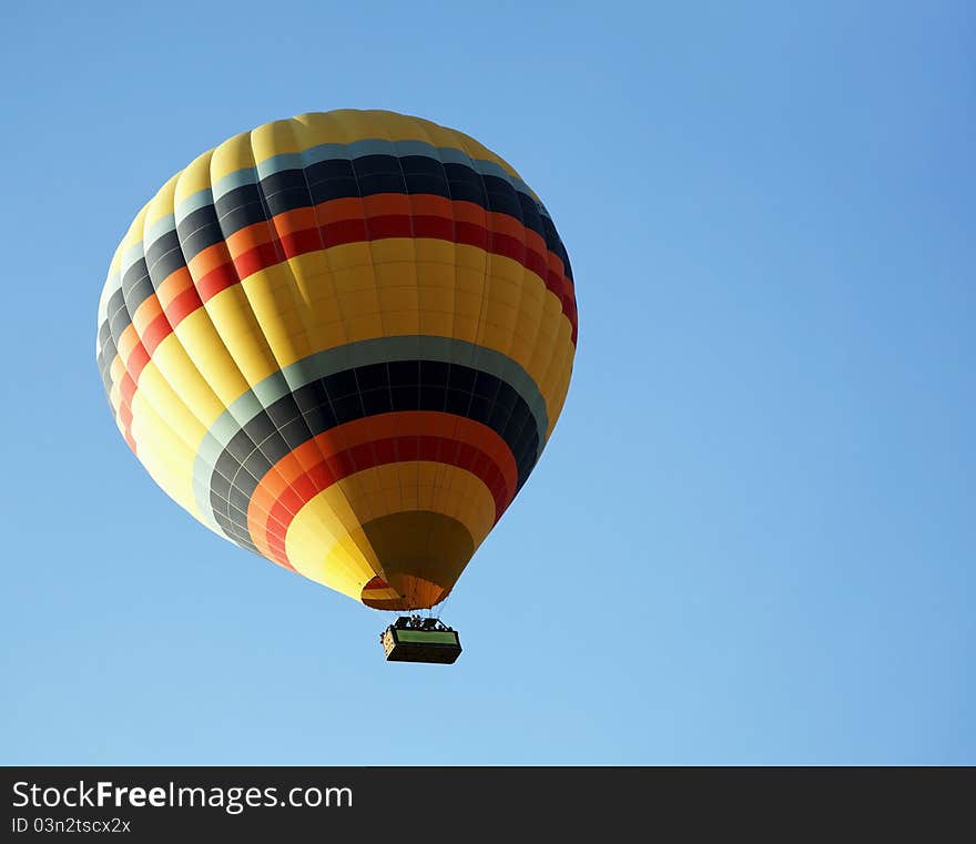 Yellow hot air balloon with color sky, view from bottom, landscape, copy space and crop space. Yellow hot air balloon with color sky, view from bottom, landscape, copy space and crop space