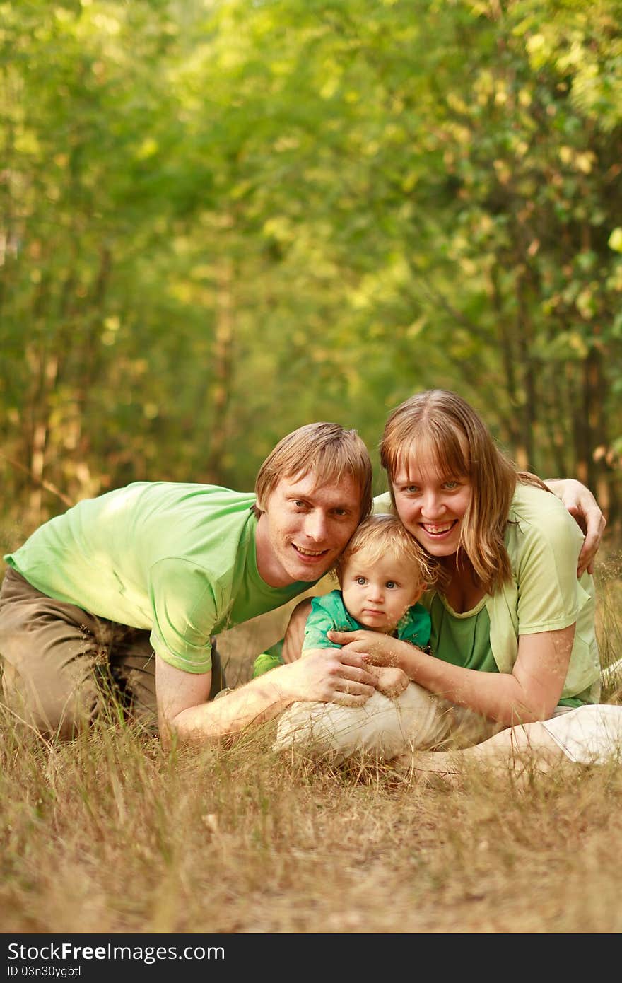 Loving young family in summer nature having fun together. Loving young family in summer nature having fun together