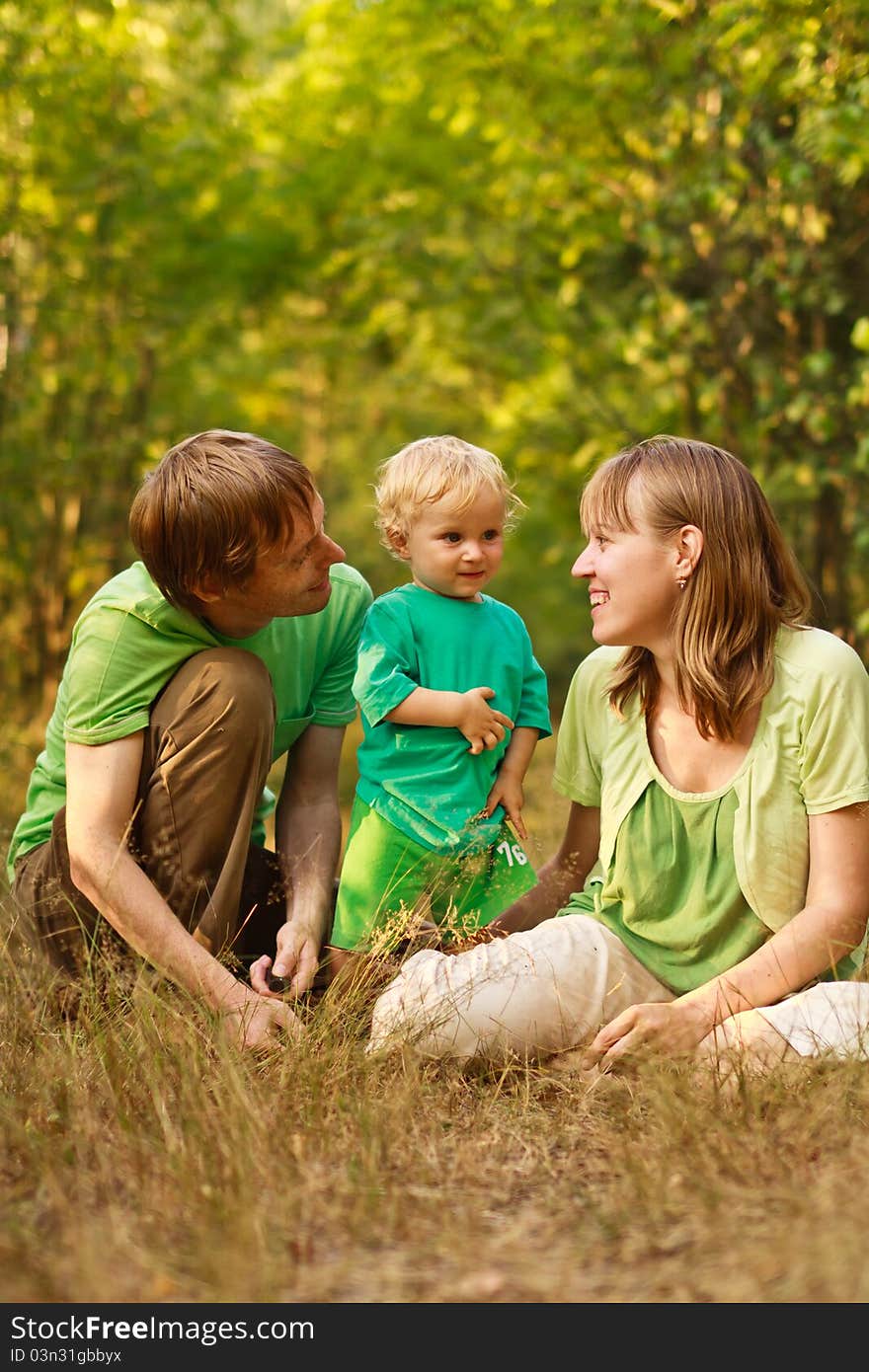 Happy young family with baby in summer nature. Happy young family with baby in summer nature