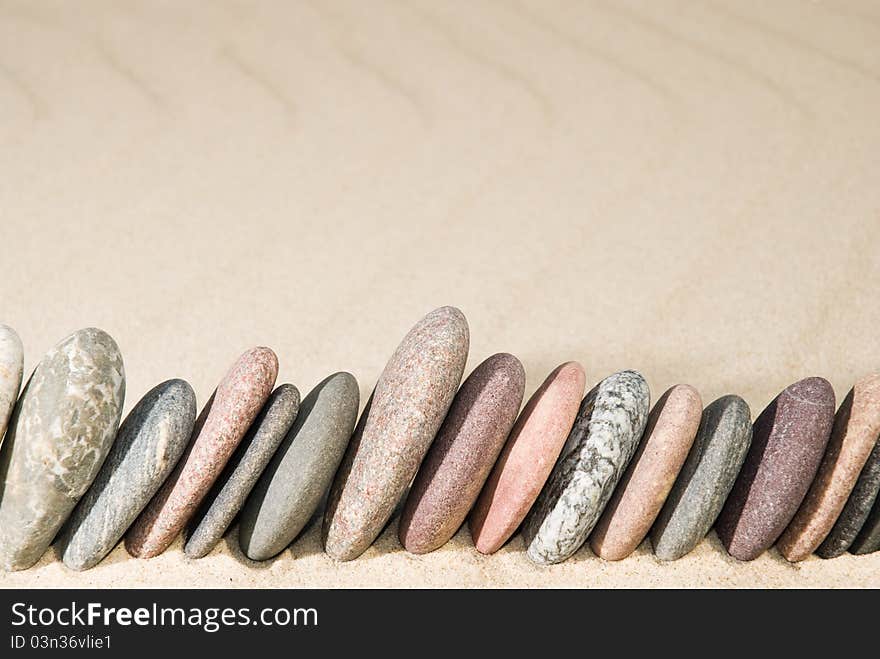 Pebble Row On Sand