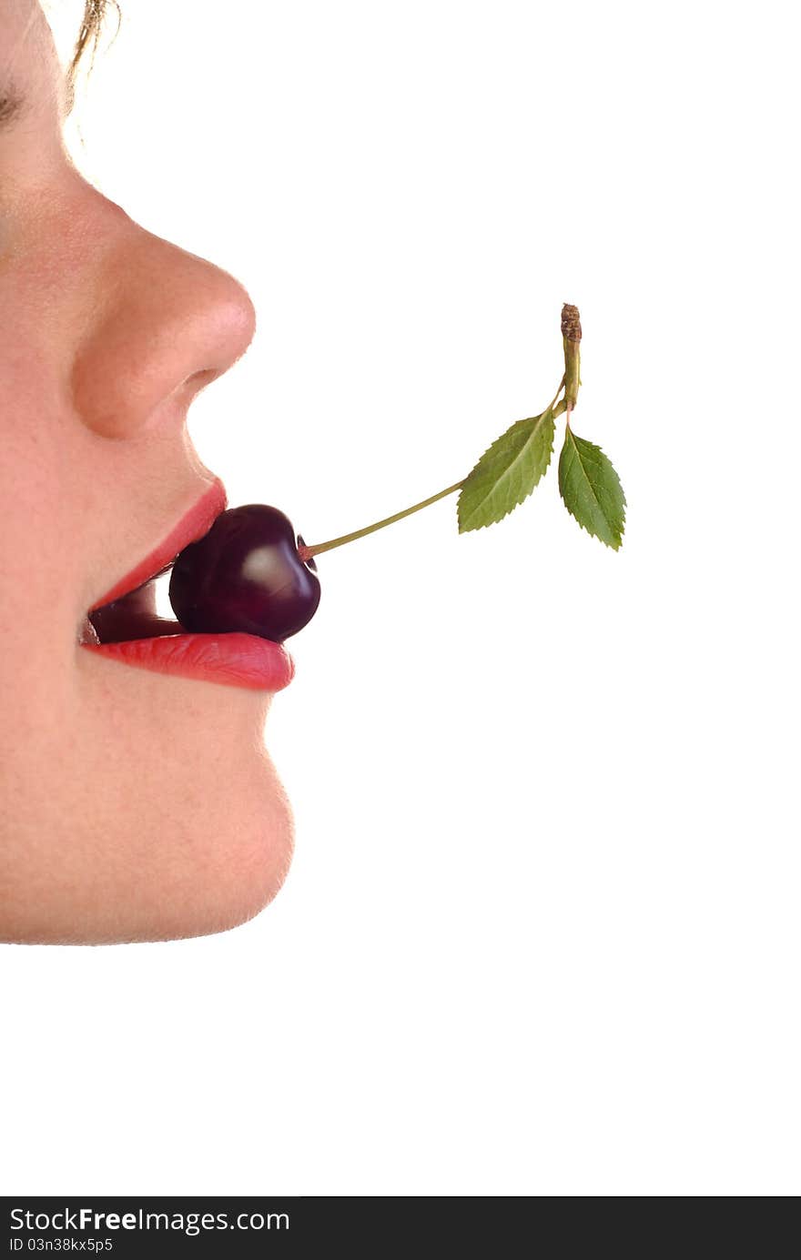 Young woman's mouth with cherry on white background. Young woman's mouth with cherry on white background