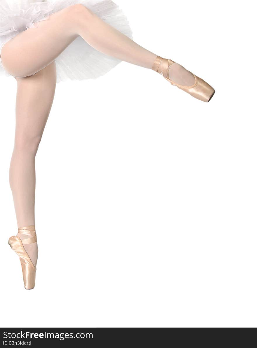 Legs of dancing ballerina on tip of toe isolated on white background