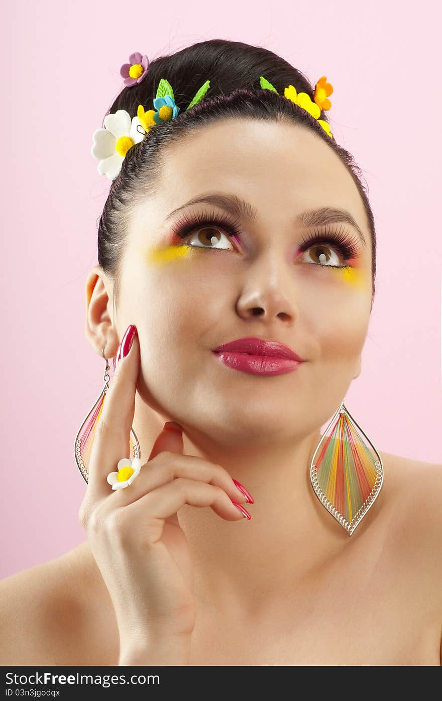 Close-up portrait of beautiful brunette with glamor make-up and color candy style