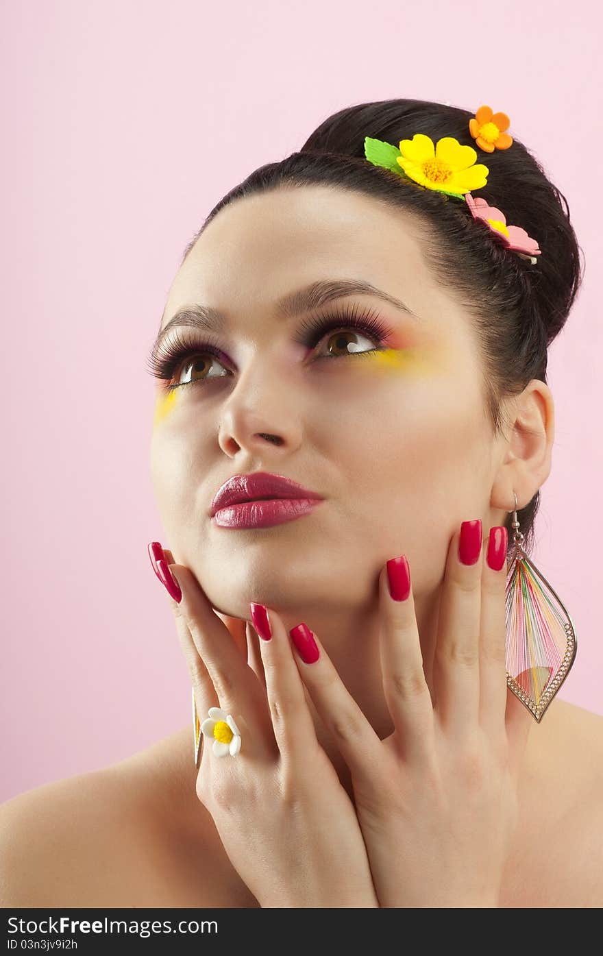 Close-up portrait of beautiful brunette with glamor make-up and color candy style