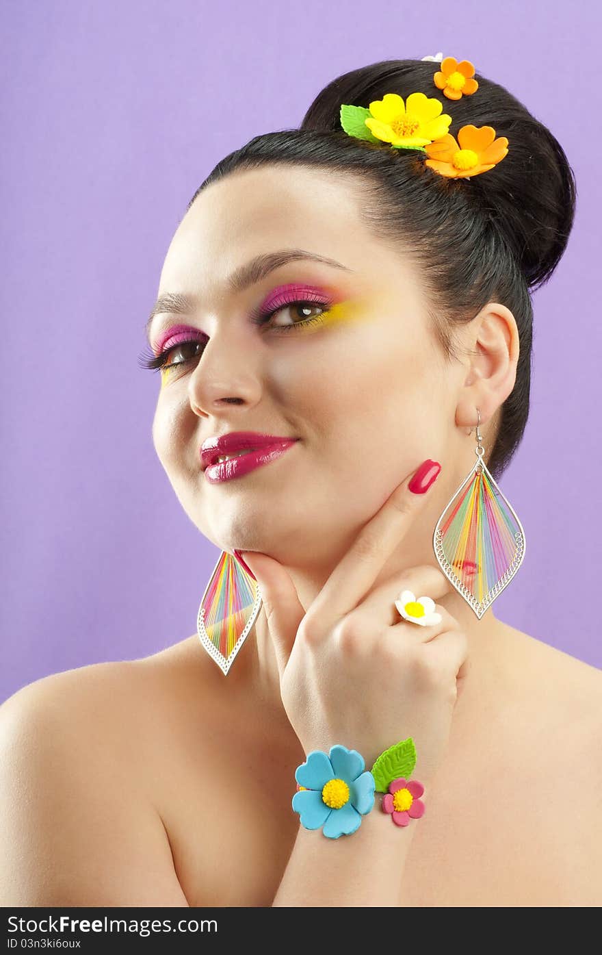 Close-up portrait of beautiful brunette with glamor make-up and color candy style