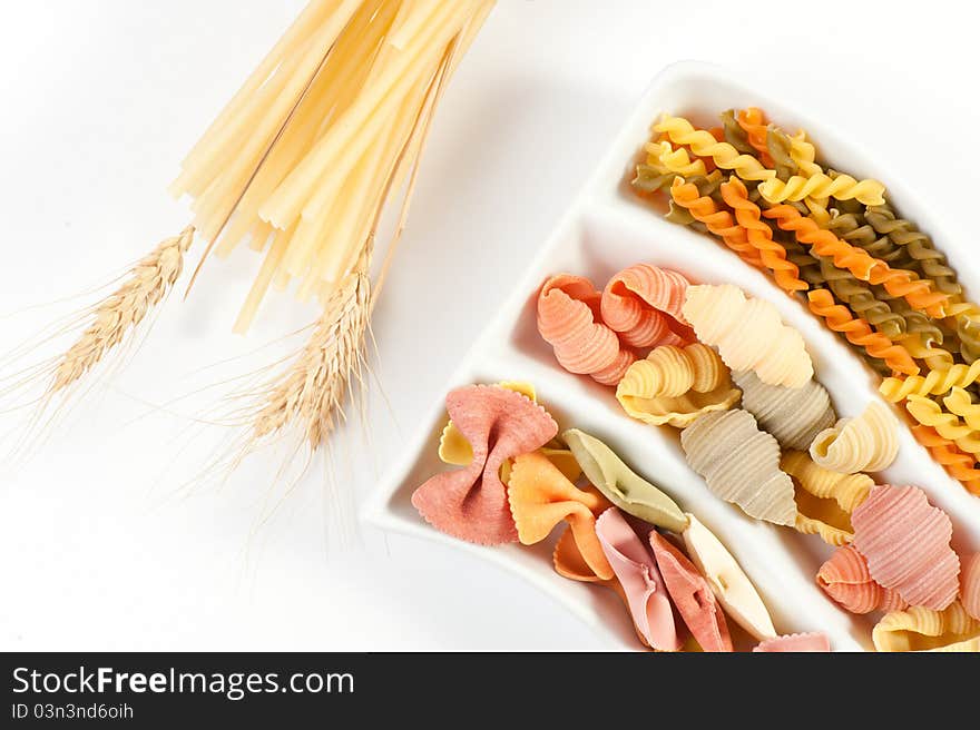 Different kinds of italian pasta on white background