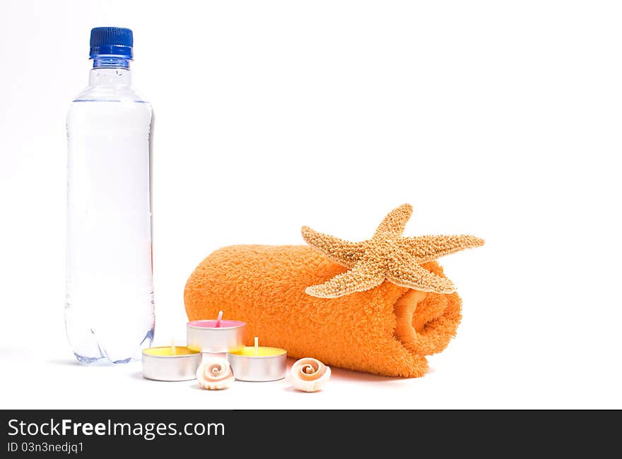 Spa objects: towel, candles and starfish