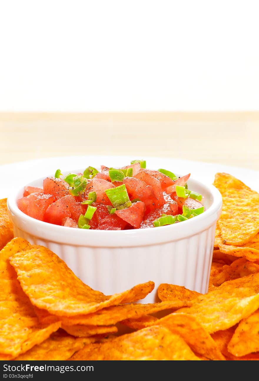 Bowl of salsa and fresh nachos