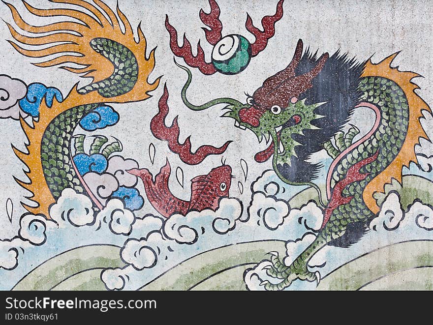 Dragon and fish painting on mable wall in chinese temple. Dragon and fish painting on mable wall in chinese temple