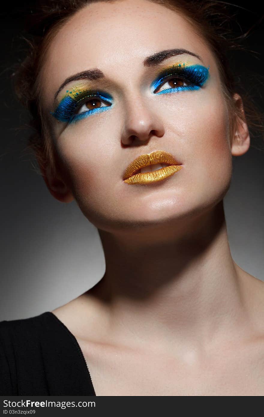 Beautiful young woman with bright make-up. Beautiful young woman with bright make-up