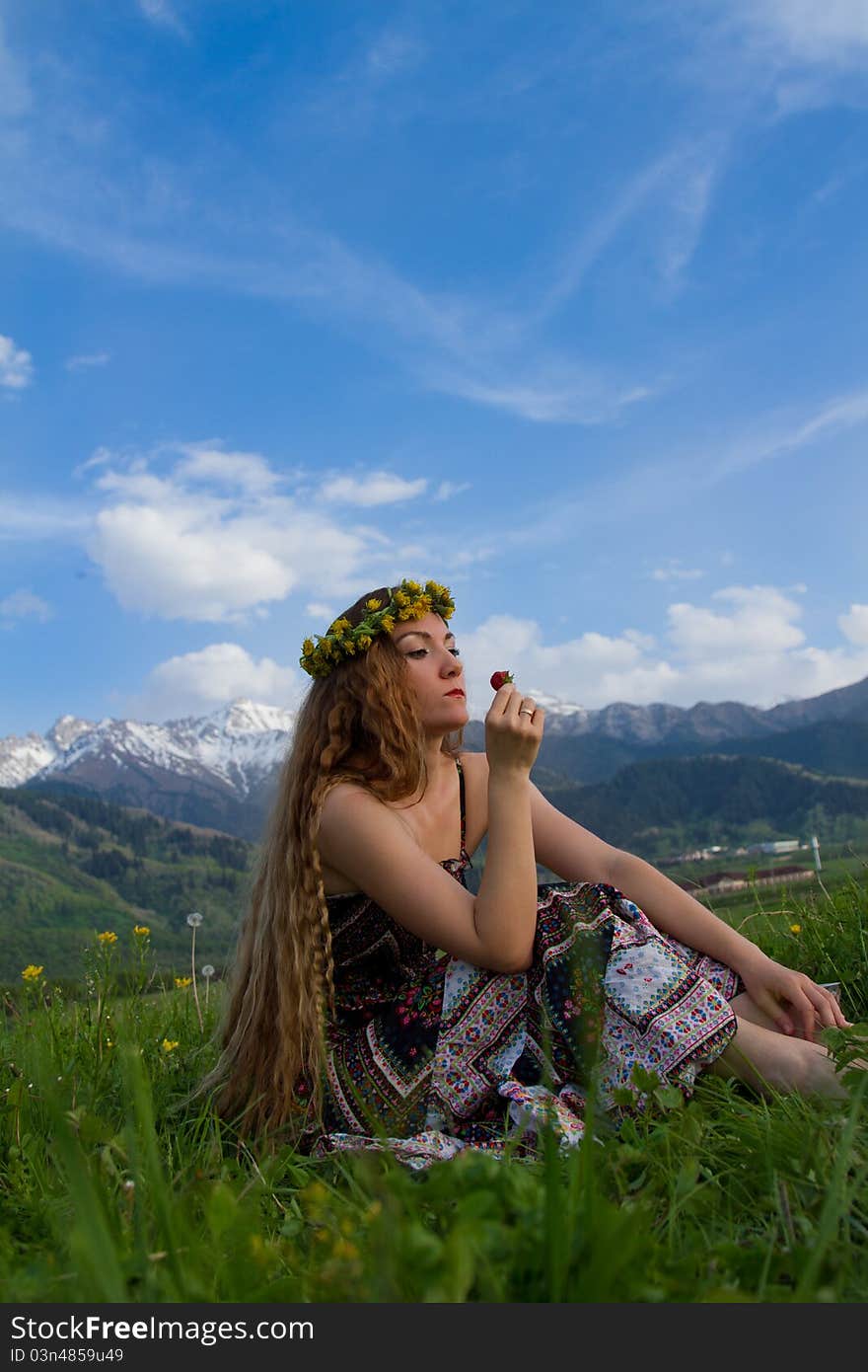 Beautiful Woman Eating Strawberries On Blue Sky Ba