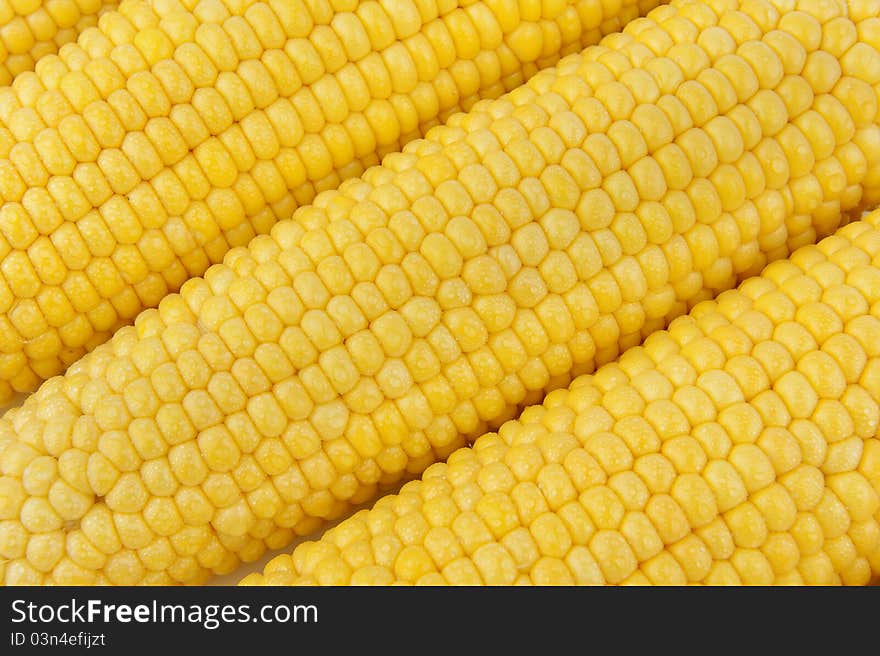 Three ears of corn. Corn background.