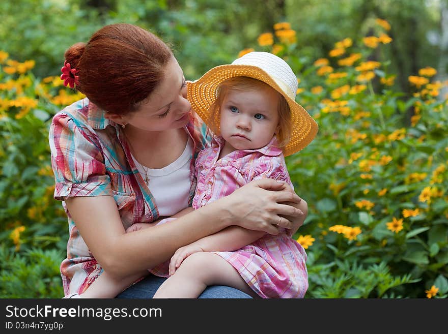 Mother With Daughter In The Garden