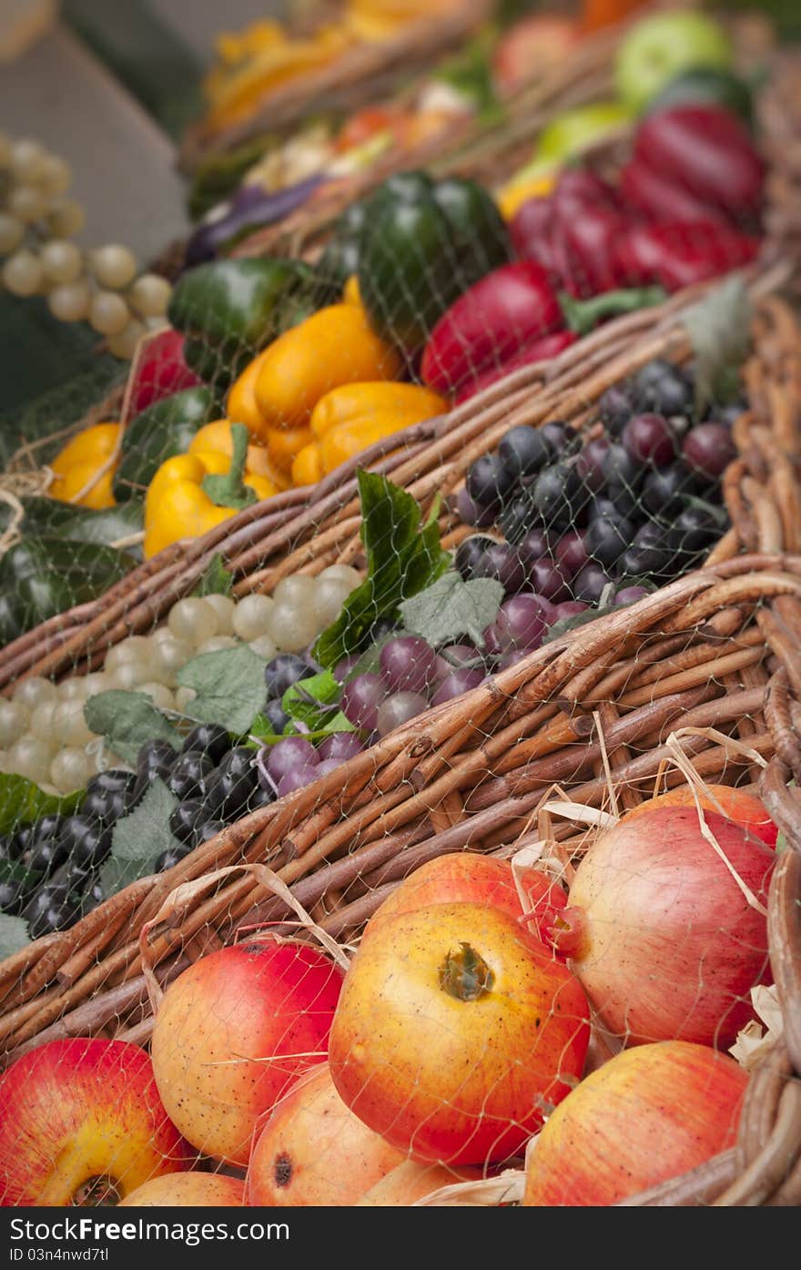 Ripe fruits and vegetables in baskets