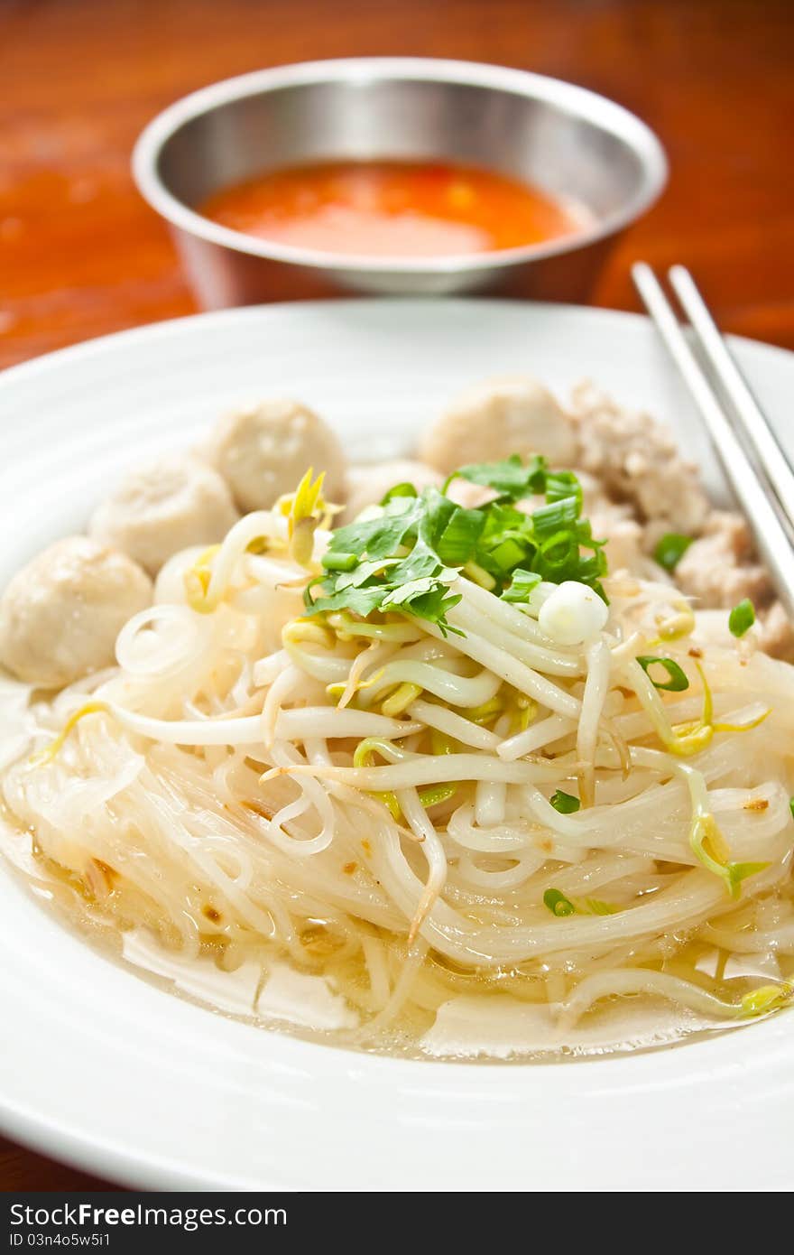 Skinny noodles soup with vegetables and meatball